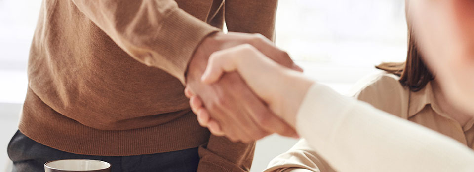 Two people shaking hands